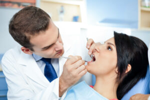 Woman Getting Her Teeth Worked On - free consultation