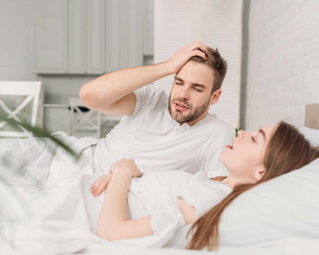 snoring woman waking up her husband - mccord orthodontics