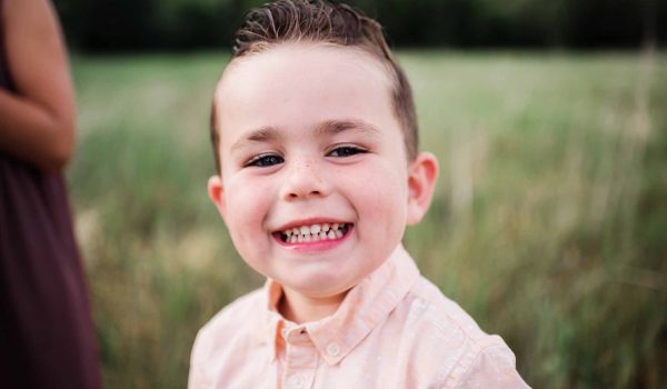 a boy with beautiful smile - adventure orthodontics